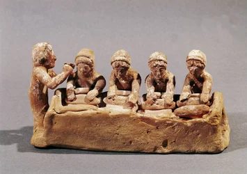 Bakers kneading dough to the sound of a flute, found at Thebes, Boeotia
